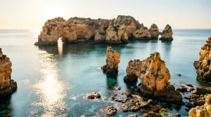 Sunset view of the rugged Algarve coastline near Lagos.