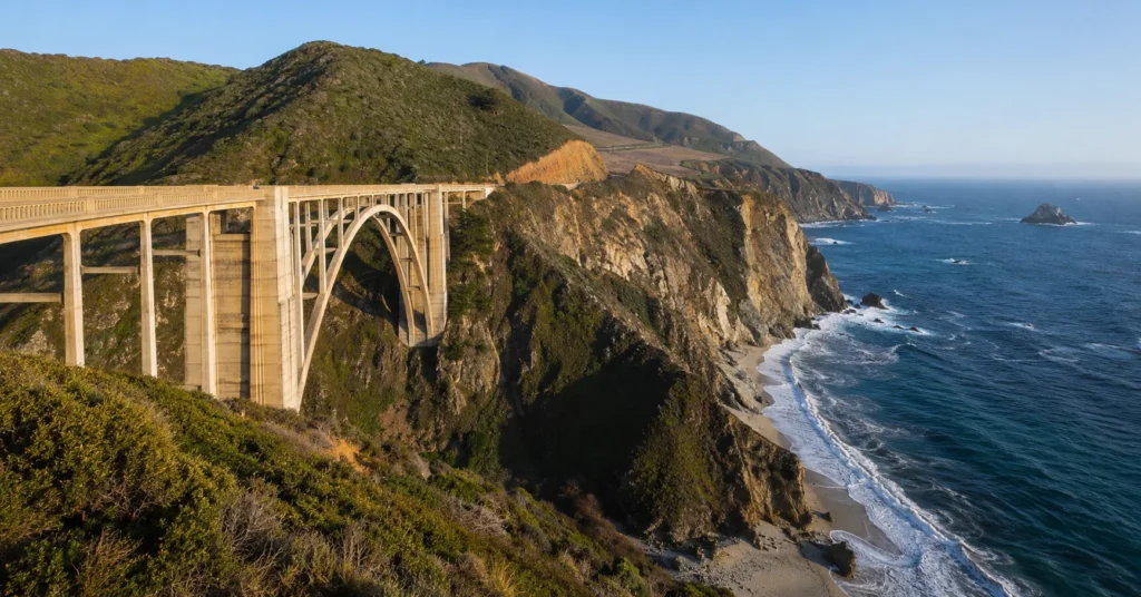Bixby Creek Bridge on the Big Sur coast along California Highway 1 during clear morning light.