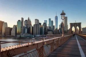 Manhattan skyline from Brooklyn Bridge at sunrise