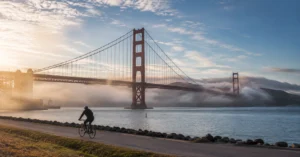 Golden Gate Bridge at sunrise from Crissy Field with morning fog lifting, San Francisco