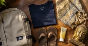 Packed essentials for Thailand travel: quick-dry clothing, temple-appropriate scarf, lightweight daypack, and sunscreen