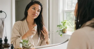 hair care routine application of conditioner in natural morning light
