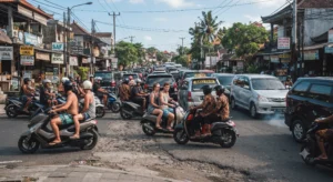 Dense traffic jam on a narrow Bali street with tourists and locals riding scooters alongside cars.