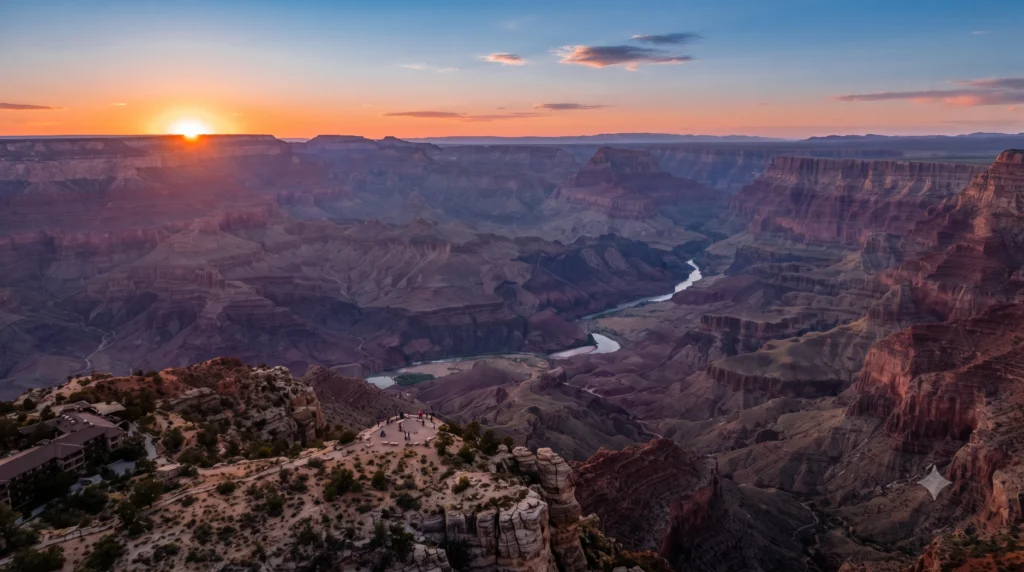 Grand Canyon South Rim panoramic vista looking toward the Colorado River during golden hour sunset.