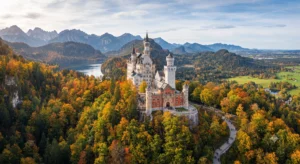 Neuschwanstein Castle perched on a wooded hill in Bavaria Germany